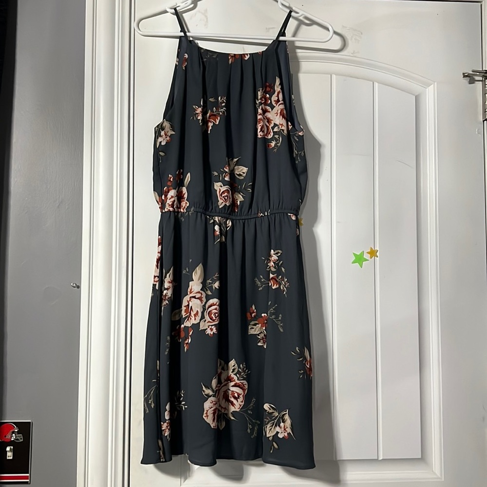 A grey dress with flowers on it